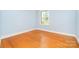 Bedroom with hardwood floors and natural light from a window at 3526 Craig Ave, Charlotte, NC 28211
