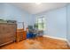 Bedroom with hardwood floors, natural light, and traditional decor at 3526 Craig Ave, Charlotte, NC 28211