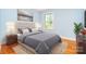 Staged bedroom with soft lighting, plush bedding, and calming decor at 3526 Craig Ave, Charlotte, NC 28211