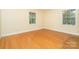 Bright bedroom with hardwood floors and natural light at 3526 Craig Ave, Charlotte, NC 28211