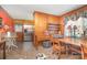 Eat-in kitchen with stainless steel appliances, wood paneling, and ample cabinet space at 3526 Craig Ave, Charlotte, NC 28211