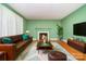 Staged living room with warm fireplace, sofa, and stylish decor at 3526 Craig Ave, Charlotte, NC 28211