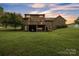 Spacious backyard with a two-story brick home featuring a deck and lower level garage at 3998 Holly Springs Dr # 20, Newton, NC 28658