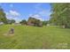 Expansive backyard with lush lawn and mature trees and outbuildings at 3998 Holly Springs Dr # 20, Newton, NC 28658