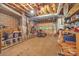 Unfinished basement and garage space, featuring utilities and lawn equipment at 3998 Holly Springs Dr # 20, Newton, NC 28658