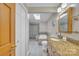 Neutral bathroom with a skylight, double vanity, soaking tub, and separate glass enclosed shower at 3998 Holly Springs Dr # 20, Newton, NC 28658