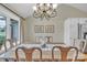 Bright dining room with natural light and stylish chandelier fixture at 3998 Holly Springs Dr # 20, Newton, NC 28658
