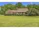 Charming brick home with manicured lawn and mature trees at 3998 Holly Springs Dr # 20, Newton, NC 28658