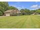 Exterior view of a brick home with a well-manicured lawn and lush landscaping at 3998 Holly Springs Dr # 20, Newton, NC 28658