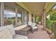 Inviting front porch featuring comfortable seating and lush landscaping at 3998 Holly Springs Dr # 20, Newton, NC 28658