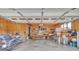 Spacious garage interior with ample storage shelving, window, and motorcycle parked inside at 3998 Holly Springs Dr # 20, Newton, NC 28658