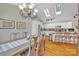 Open kitchen with island seating, stainless appliances, and skylights at 3998 Holly Springs Dr # 20, Newton, NC 28658