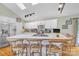 Bright kitchen with white cabinets, stainless steel appliances, and a large center island with seating at 3998 Holly Springs Dr # 20, Newton, NC 28658