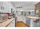 Bright kitchen featuring white cabinetry, stainless steel appliances, and hardwood floors at 3998 Holly Springs Dr # 20, Newton, NC 28658
