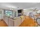Cozy living room with a brick fireplace and open access to the kitchen at 3998 Holly Springs Dr # 20, Newton, NC 28658