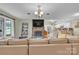 Spacious living room with brick fireplace open to the kitchen and dining area at 3998 Holly Springs Dr # 20, Newton, NC 28658