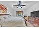 Bright main bedroom features a ceiling fan, a window, and a wooden dresser at 3998 Holly Springs Dr # 20, Newton, NC 28658