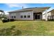 Spacious backyard with a covered patio offering a great space for outdoor living and entertaining at 4026 Honey Locust Dr, Charlotte, NC 28215