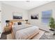 Serene primary bedroom with a plush bed, neutral decor, and ample natural light creating a relaxing retreat at 4026 Honey Locust Dr, Charlotte, NC 28215