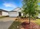 Beautiful home with a two-car garage and lovely landscaping enhancing its curb appeal at 4026 Honey Locust Dr, Charlotte, NC 28215