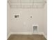 Laundry room with tile floor has shelving and hookups ready for appliances at 4026 Honey Locust Dr, Charlotte, NC 28215