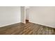 The living room features hardwood floors and neutral-colored walls at 4026 Honey Locust Dr, Charlotte, NC 28215