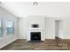 Living room with fireplace and hardwood floors at 4026 Honey Locust Dr, Charlotte, NC 28215