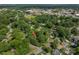 The aerial view captures the home's location in a leafy neighborhood with street access at 411 Hanna St, Gastonia, NC 28052