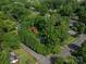 An aerial view showcases the property nestled among lush greenery and neighboring homes at 411 Hanna St, Gastonia, NC 28052