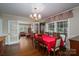 Bright dining room with hardwood floors and open access to the living room at 411 Hanna St, Gastonia, NC 28052