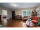 Spacious living room with hardwood floors and large windows at 411 Hanna St, Gastonia, NC 28052