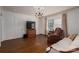 Spacious living room with hardwood floors, neutral colors, and large windows allowing natural light at 411 Hanna St, Gastonia, NC 28052