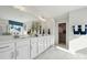 Elegant bathroom with dual sinks, quartz countertops, and walk-in closet at 423 Balboa St, Matthews, NC 28104
