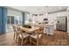 Modern, bright kitchen with white cabinetry, stainless steel appliances and a spacious island at 423 Balboa St, Matthews, NC 28104