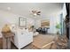 Bright living room featuring a ceiling fan, stylish decor, and a cozy rug at 423 Balboa St, Matthews, NC 28104