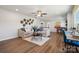 Bright living room with sofas, a decorative wall, and wood flooring, offering a welcoming area at 423 Balboa St, Matthews, NC 28104
