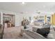 Bright, airy main bedroom with sitting area, soft carpet, and multiple windows at 423 Balboa St, Matthews, NC 28104