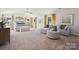 Spacious main bedroom featuring sitting area, large windows, and neutral carpeting at 423 Balboa St, Matthews, NC 28104
