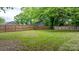 Large backyard with a wooden fence and plenty of green space at 425 1St Se Ave, Hickory, NC 28602