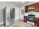 Kitchen with stainless steel refrigerator and appliances, and featuring dark wood cabinetry at 425 1St Se Ave, Hickory, NC 28602