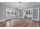 Living room featuring hardwood floors, large windows, and french doors at 425 1St Se Ave, Hickory, NC 28602