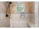 Shower with decorative tile, built-in niche and shower bench at 425 1St Se Ave, Hickory, NC 28602