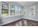 This bright sun room has big windows with lots of light and beautiful dark hardwood floors at 425 1St Se Ave, Hickory, NC 28602