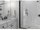 Modern bathroom featuring white tiling, a black framed glass shower, and white vanity with sink at 4419 Splash Trl # 158, Sherrills Ford, NC 28673