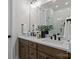 Modern bathroom with a double vanity, marble countertop, and decorative plant at 4419 Splash Trl # 158, Sherrills Ford, NC 28673