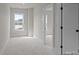Bright bedroom with large window and neutral carpet offers a serene and comfortable living space at 4419 Splash Trl # 158, Sherrills Ford, NC 28673