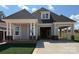 Charming craftsman-style home with gray siding, brick accents, and a covered front porch at 4419 Splash Trl # 158, Sherrills Ford, NC 28673