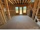 Framed interior with wood studs, three windows and an unfinished staircase at 4419 Splash Trl # 158, Sherrills Ford, NC 28673