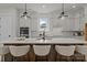 Bright kitchen boasts a large island with seating, quartz countertops and modern pendant lighting at 4419 Splash Trl # 158, Sherrills Ford, NC 28673