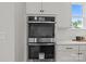 Close-up of stainless steel oven and microwave appliances complemented by white cabinetry at 4419 Splash Trl # 158, Sherrills Ford, NC 28673